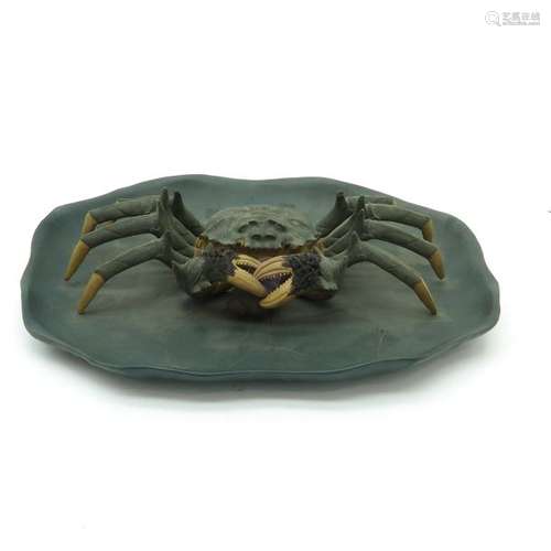 A Yixing Tray Depicting crab holding shell in cent...