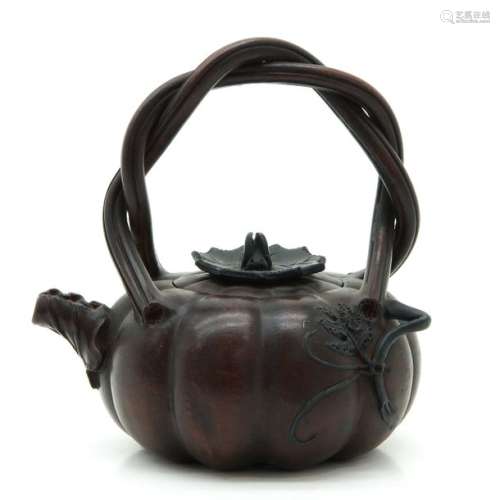 A Yixing Teapot In pumpkin form, marked on bottom ...