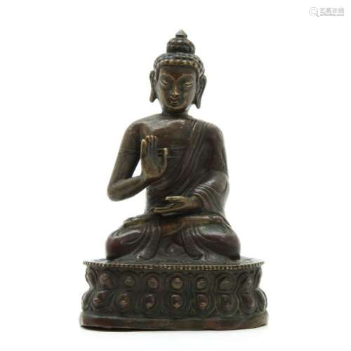 A Metal Buddha Sculpture Depicting seated Buddha, ...