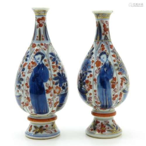 A Pair of Small Polychrome Decor Vases Alternating...