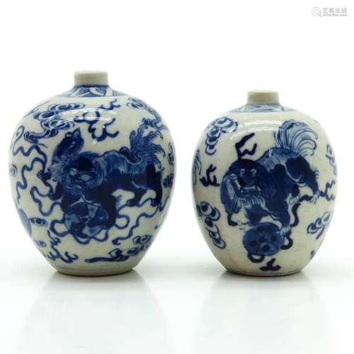 A Pair of Small Blue and White Decorated Vases Dep...