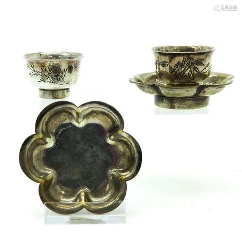 A Pair of Miniature Cup and Saucer Engraved floral...