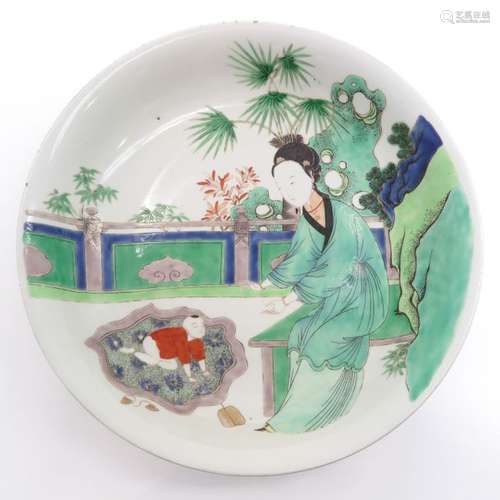 A Famille Verte Plate Depicting lady in garden wit...