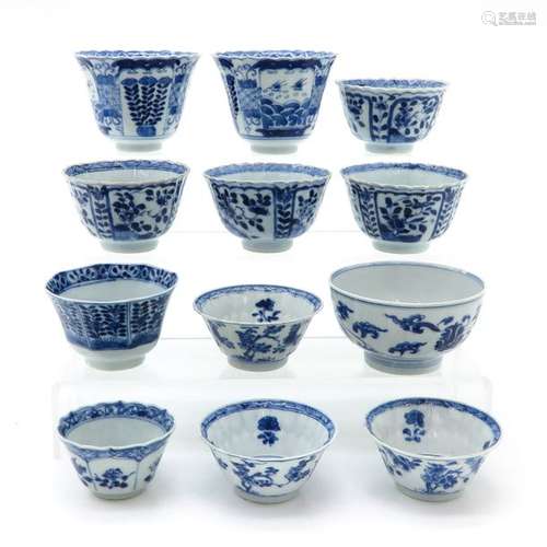 Diverse Lot of Blue and White Cups Largest cup is ...