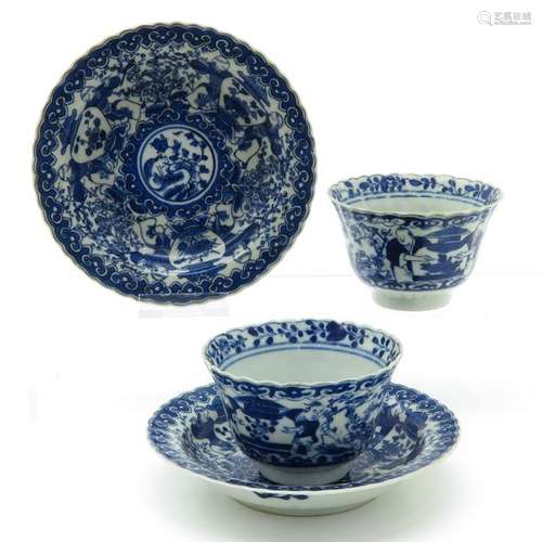 A Pair of Blue and White Decorated Cups and Sacuer...