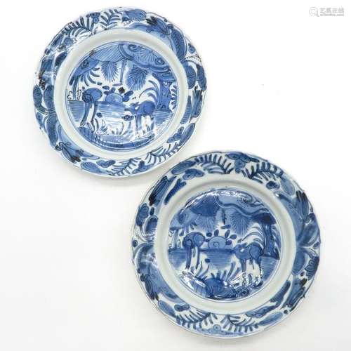 A Pair of Blue and White Wanli Plates Depicting de...