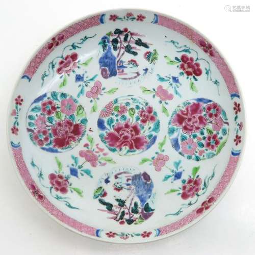 A Famille Rose Plate Depicting scenes with flowers...