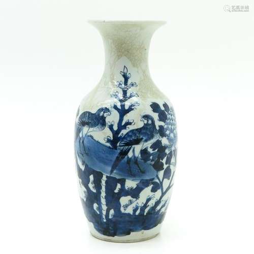 A Blue and White Decor Vase Depicting birds in tre...