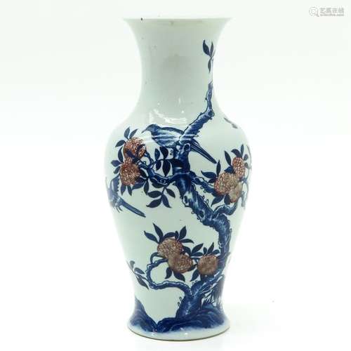 A Blue and Red Vase Depicting tree with berries an...