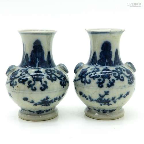 A Pair of Blue and White Vases Floral decor, marke...