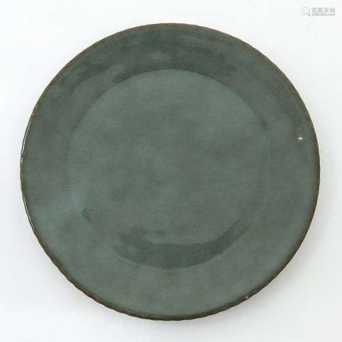 A Small Round Celadon Plate 13 cm. In diameter.		...