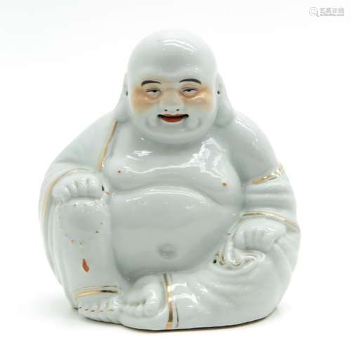 A Porcelain Buddha Sculpture Depicting seated Budd...