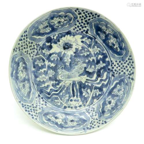 A Blue and White Plate Full decor of flowers and b...