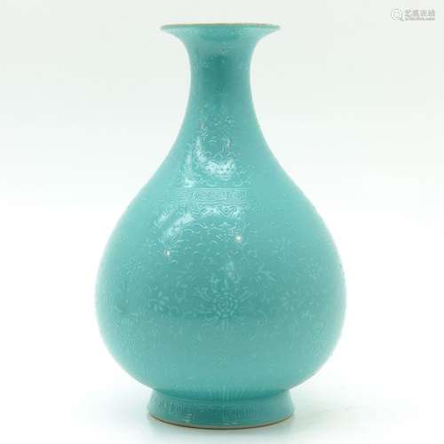 A Light Green Monchrome Vase Raised floral decor, ...