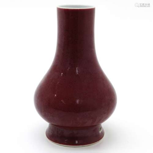 A Ruby Glazed Vase In sepckled decor, marked on bo...