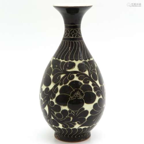 A Brown and White Decorated Vase White ground with...