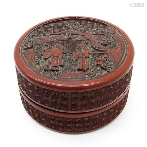 A Round Cinnabar Lacquer Box Depicting Chinese men...