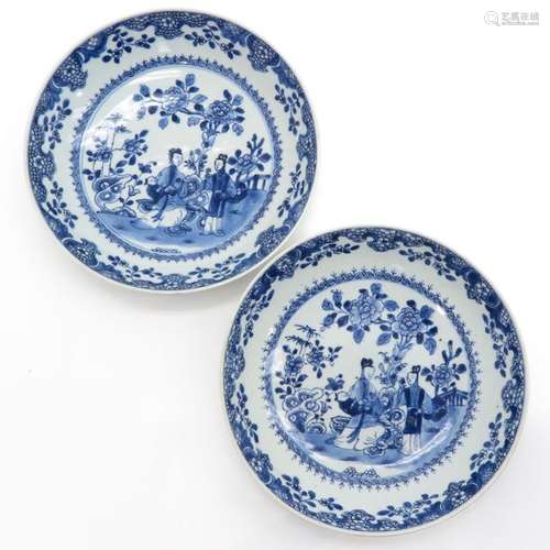 A Pair of Blue and White Plates Depicting ladies i...