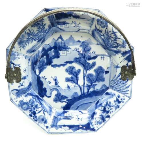 A Blue and White Octagonal Plate with Silver Hadle...