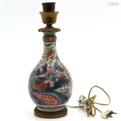 A Polychrome Decor Lamp Bronze fittings on top and...