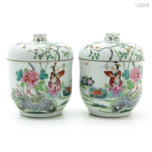 A Pair of Polychrome Decor Covered Jars Depicting ...