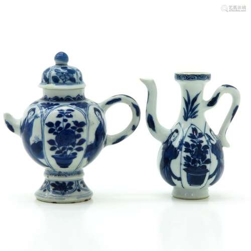 A Lot of 2 Small Blue and White Teapots Both depic...