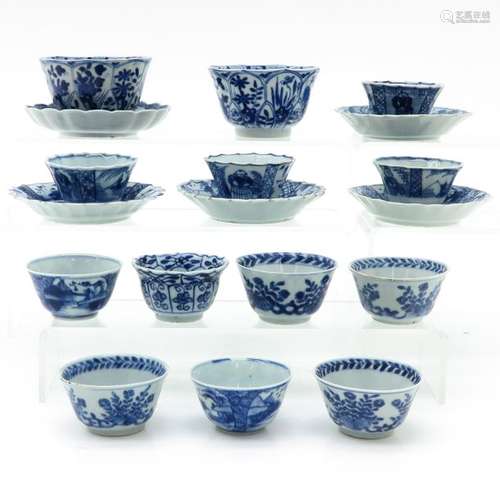 A Diverse Lot of Blue and White Cups and Saucers 1...