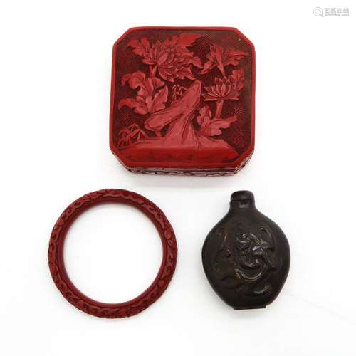 A Cinnabar Box, Bracelet and Snuff Bottle Box is 9...