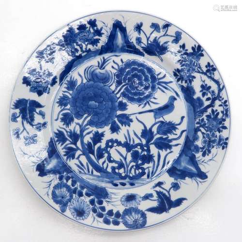 A Blue and White Plate Depicting flowers and birds...