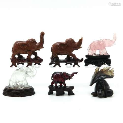 A Collection of Elephant Sculptures with Base Incl...