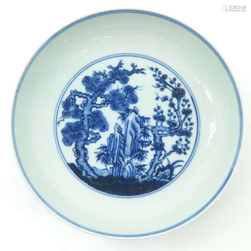 A Blue and White Decorated Plate Depicting blossom...