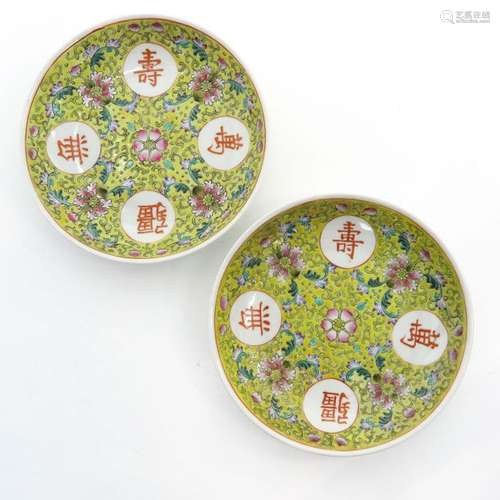 A Pair of Polychrome Decor Plates Yellow ground wi...