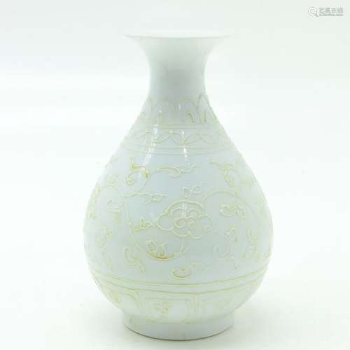 A White Glaze Vase Raised floral decor, also raise...