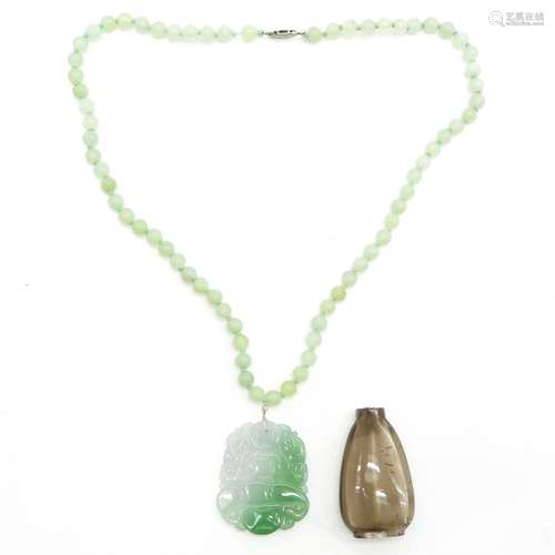 A Jade Necklace and Glass Snuff Bottle Jade neckla...