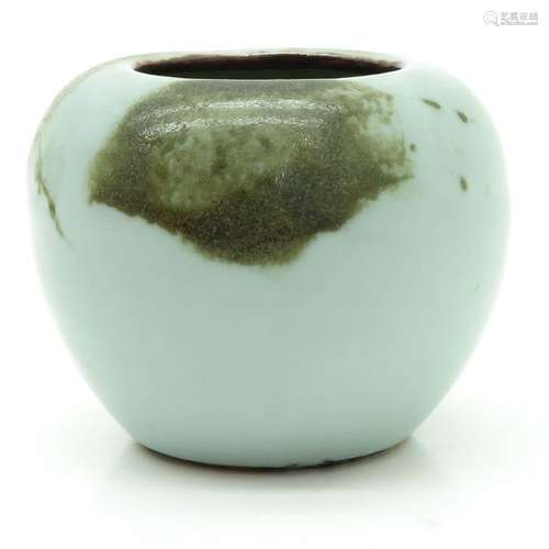 A Celadon Vase Dark green glaze decor over celadon...