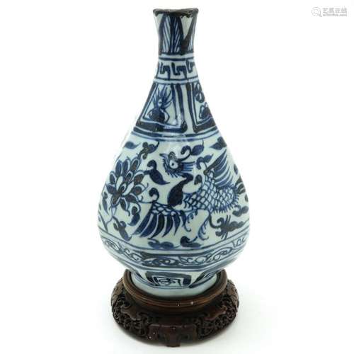 A Blue and White Vase on Wood Base Blue floral dec...