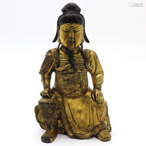 A Bronze Sculpture Depicting seated man dressed in...