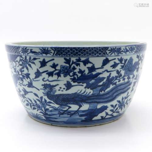 A Large Blue and White Pot Depicting flowers and b...