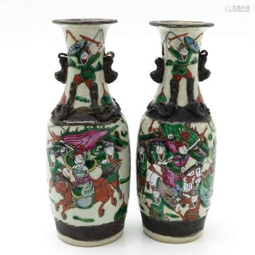 A Pair of Nanking Vases  Depicting warriors on ho...