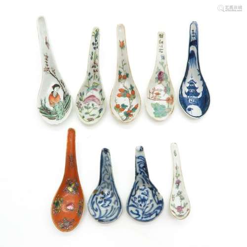 A Lot of 9 Porcelain Spoons Longest is 15 cm.		A ...