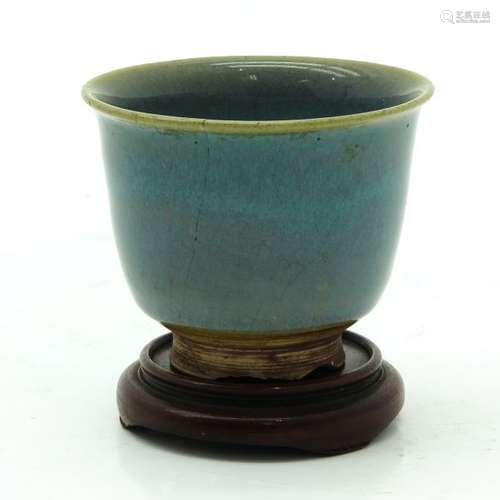 A Monochrome Cup and Base Blue glaze, with wax sea...