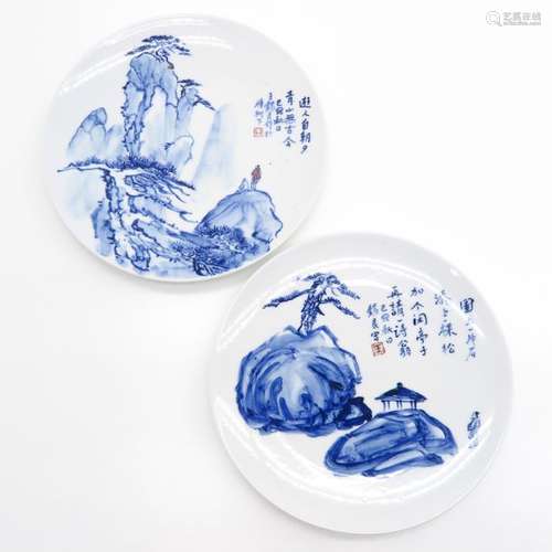 A Pair of Blue and White Plates Depicting landscap...