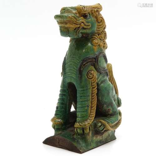 A Temple Lion Sculpture Green and yellow glaze, 27...