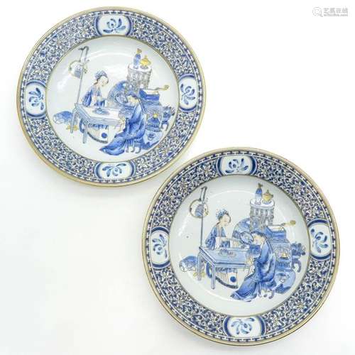 A Pair of Blue and Gold Decor Plates Depicting Chi...