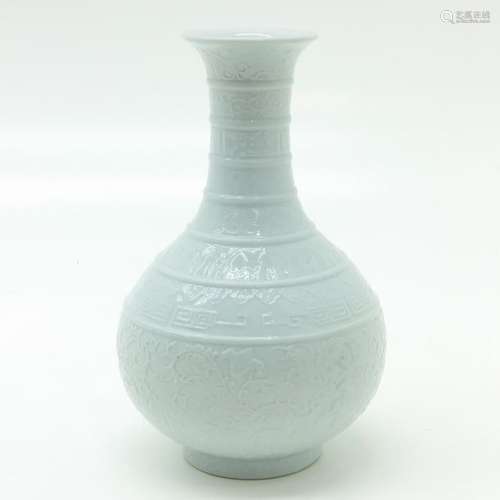 A Blanc de Chine Vase Raised floral decor, marked ...