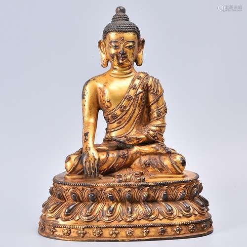 A GILT-BRONZE FIGURE OF BUDDHA