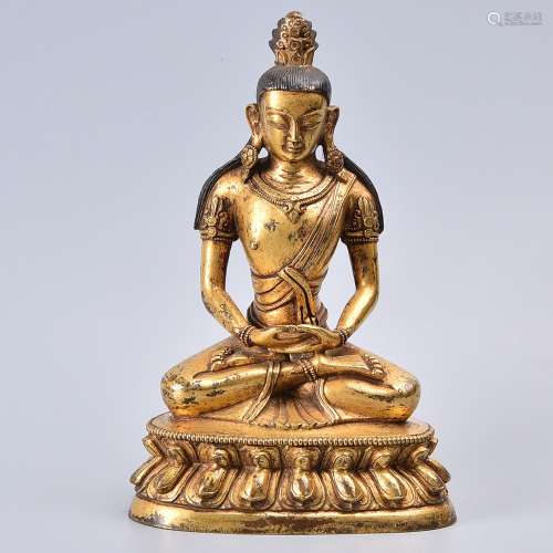 A GILT-BRONZE FIGURE OF BUDDHA