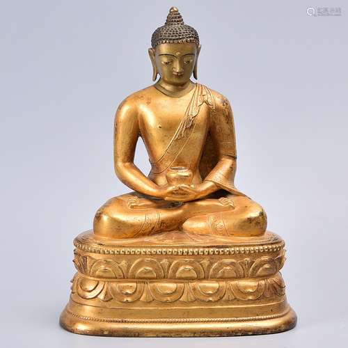 A GILT-BRONZE FIUGRE OF SHAKYAMUNI