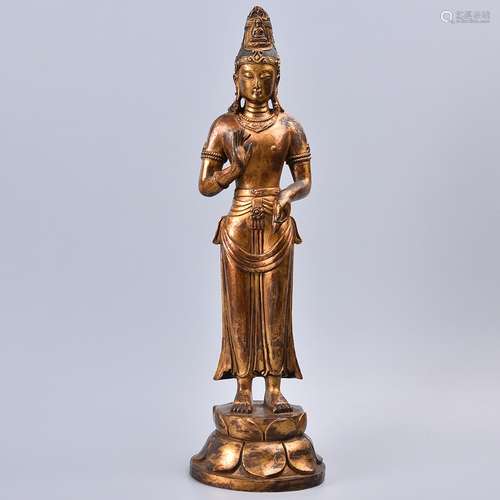 A GILT-BRONZE FIGURE OF STANDING GUANYIN