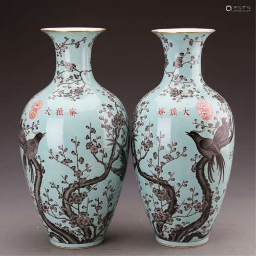 A PAIR OF BLUE-GROUND FAMILLE ROSE VASES